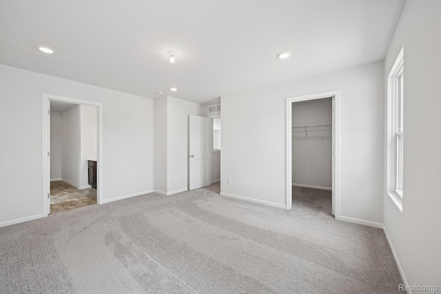 4311 Oak St, Grand Blanc, MI 48439 - unfurnished bedroom featuring carpet, recessed lighting, a spacious closet, and ensuite bath