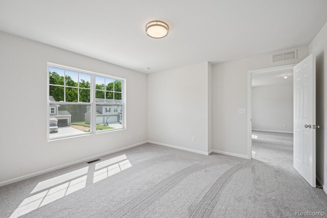 4311 Oak St, Grand Blanc, MI 48439 - carpeted empty room featuring baseboards
