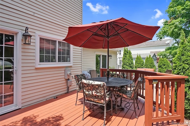 54286 Bradshaw Dr, New Baltimore, MI 48047 - wooden deck featuring outdoor dining area