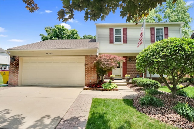 54286 Bradshaw Dr, New Baltimore, MI 48047 - view of front facade featuring brick siding, an attached garage, and driveway