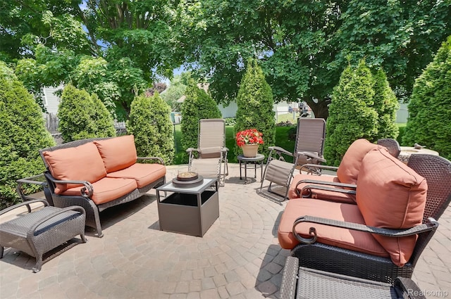 54286 Bradshaw Dr, New Baltimore, MI 48047 - view of patio with an outdoor living space with a fire pit