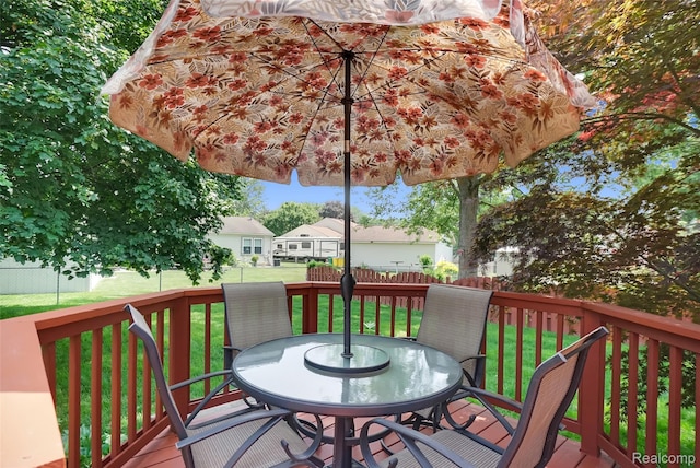 54286 Bradshaw Dr, New Baltimore, MI 48047 - wooden deck with outdoor dining area and a fenced backyard