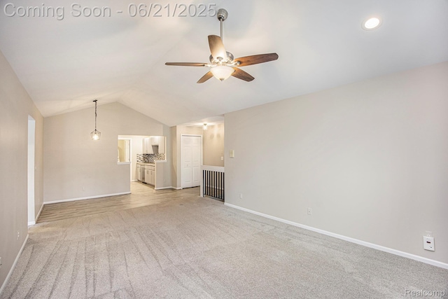 56217 Troon N, Utica, MI 48316 - unfurnished living room with a ceiling fan, lofted ceiling, and light carpet