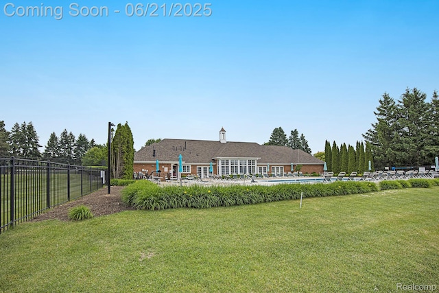 56217 Troon N, Utica, MI 48316 - rear view of house with a community pool