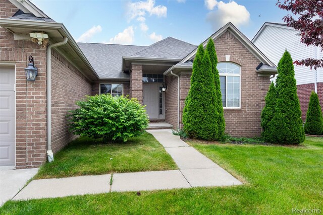 52854 Schafers Run Ct, New Baltimore, MI 48051 - view of front of home featuring brick siding, roof with shingles, and a front yard