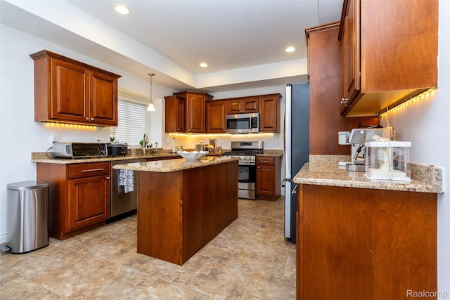 52854 Schafers Run Ct, New Baltimore, MI 48051 - kitchen with stainless steel appliances, a center island, recessed lighting, light stone countertops, and pendant lighting