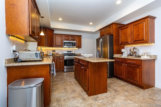 52854 Schafers Run Ct, New Baltimore, MI 48051 - kitchen with appliances with stainless steel finishes, a center island, light stone countertops, recessed lighting, and a tray ceiling