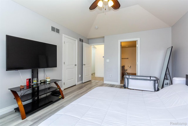 52854 Schafers Run Ct, New Baltimore, MI 48051 - bedroom with vaulted ceiling, light wood-style flooring, ensuite bathroom, and ceiling fan