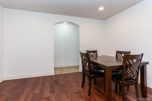 52854 Schafers Run Ct, New Baltimore, MI 48051 - dining space featuring arched walkways, wood finished floors, and recessed lighting