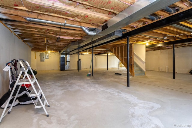 52854 Schafers Run Ct, New Baltimore, MI 48051 - unfinished basement featuring stairs, heating unit, and electric panel