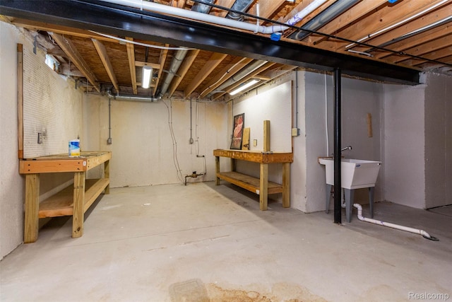 52854 Schafers Run Ct, New Baltimore, MI 48051 - unfinished basement with a workshop area