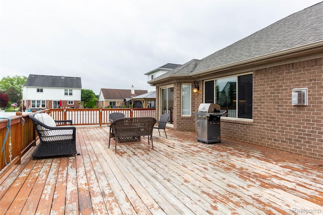 52854 Schafers Run Ct, New Baltimore, MI 48051 - wooden deck with grilling area and outdoor dining area