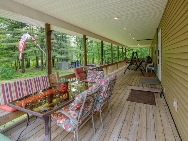 55840 Western Ave, Mattawan, MI 49071 - wooden deck with outdoor dining area and a shed