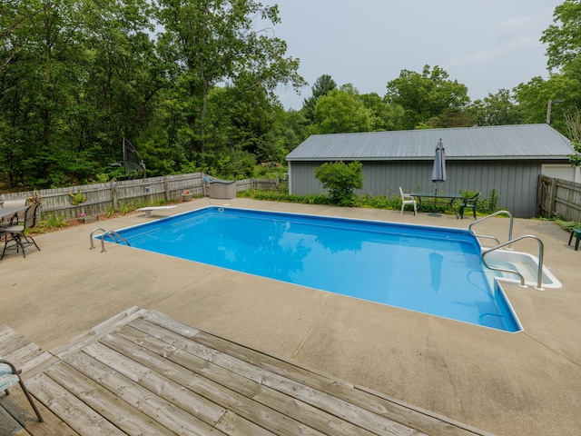 55840 Western Ave, Mattawan, MI 49071 - view of swimming pool with a fenced backyard, a patio, outdoor dining area, and a diving board