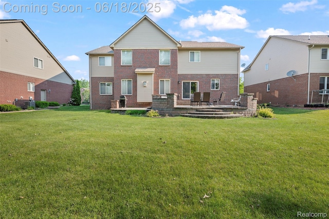 392 Gunston Ct, Troy, MI 48083 - back of house featuring a patio, a yard, and brick siding