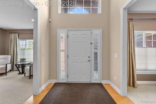392 Gunston Ct, Troy, MI 48083 - entryway with light wood-style floors and light carpet