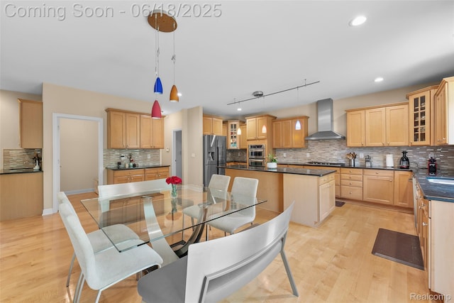 392 Gunston Ct, Troy, MI 48083 - kitchen featuring wall chimney range hood, a kitchen island, tasteful backsplash, stainless steel appliances, and dark countertops
