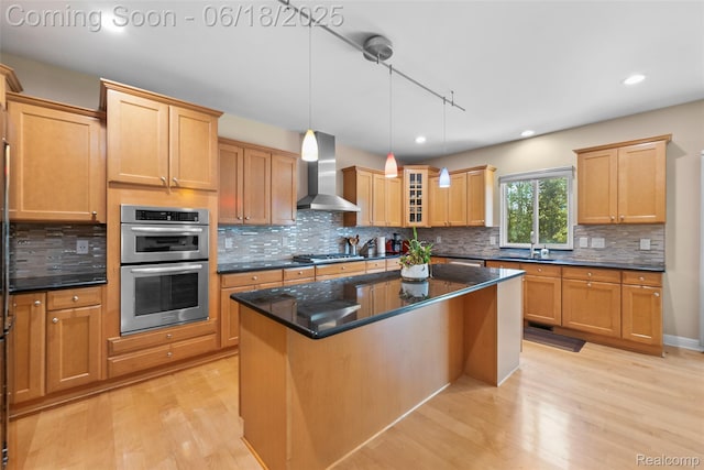 392 Gunston Ct, Troy, MI 48083 - kitchen featuring wall chimney exhaust hood, appliances with stainless steel finishes, light wood-type flooring, decorative backsplash, and recessed lighting