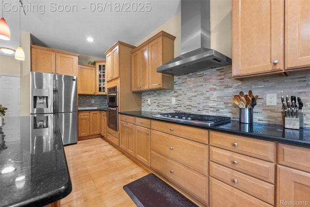 392 Gunston Ct, Troy, MI 48083 - kitchen featuring wall chimney range hood, appliances with stainless steel finishes, light wood-style flooring, dark stone countertops, and glass insert cabinets