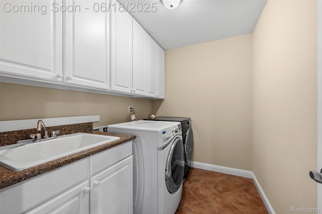 392 Gunston Ct, Troy, MI 48083 - laundry room with cabinet space, washer and clothes dryer, and dark tile patterned floors