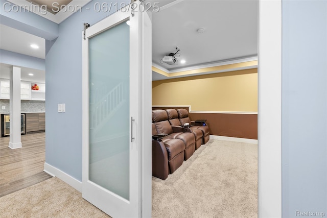 392 Gunston Ct, Troy, MI 48083 - home theater room with wine cooler, carpet floors, crown molding, and recessed lighting