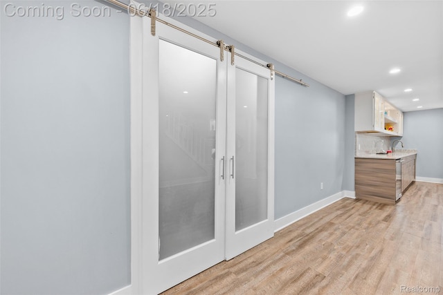 392 Gunston Ct, Troy, MI 48083 - kitchen featuring recessed lighting, light countertops, light wood-style floors, and white cabinets