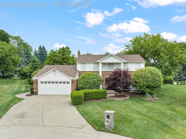 43115 Whisper Ct, Northville, MI 48168 - view of front of home with brick siding, a front lawn, a garage, and concrete driveway