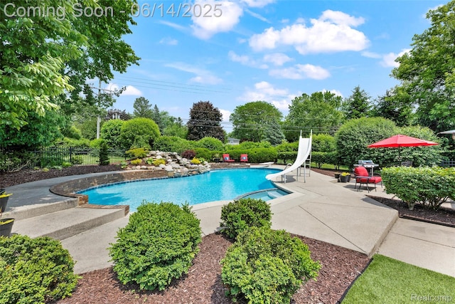 43115 Whisper Ct, Northville, MI 48168 - view of pool with a water slide and a patio area