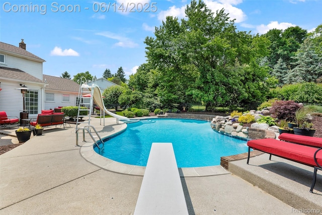 43115 Whisper Ct, Northville, MI 48168 - outdoor pool with a water slide, a patio, an outdoor hangout area, and a diving board