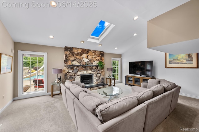 43115 Whisper Ct, Northville, MI 48168 - living area with a skylight, light carpet, a fireplace, recessed lighting, and lofted ceiling