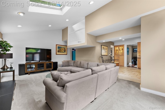 43115 Whisper Ct, Northville, MI 48168 - living room with recessed lighting, light carpet, high vaulted ceiling, and a skylight