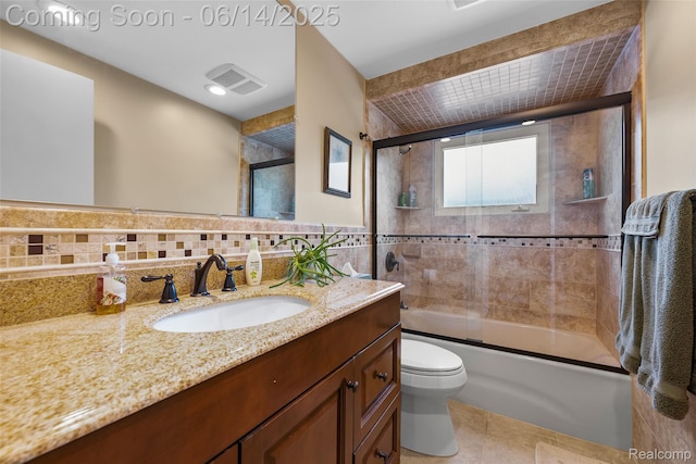 43115 Whisper Ct, Northville, MI 48168 - bathroom featuring vanity, tile walls, combined bath / shower with glass door, tile patterned flooring, and tasteful backsplash