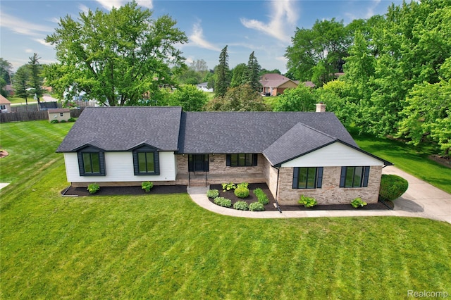 507 Charing Cross Dr, Grand Blanc, MI 48439 - view of front of property featuring a front yard, roof with shingles, and brick siding