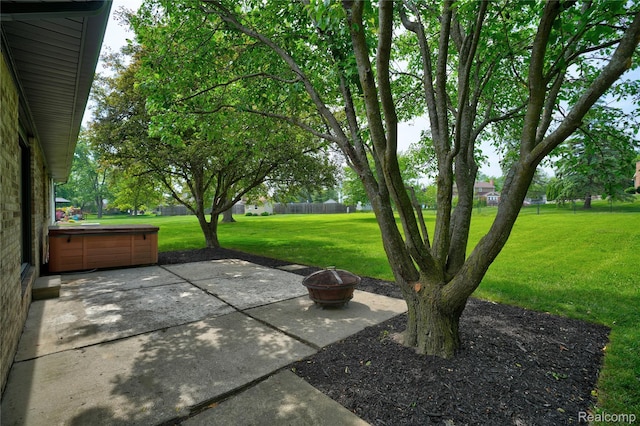 507 Charing Cross Dr, Grand Blanc, MI 48439 - view of patio with a hot tub and a fire pit