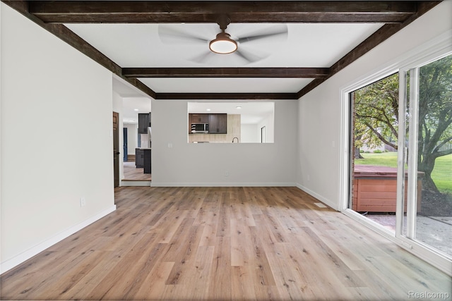 507 Charing Cross Dr, Grand Blanc, MI 48439 - unfurnished living room featuring beamed ceiling, light wood-style floors, and ceiling fan
