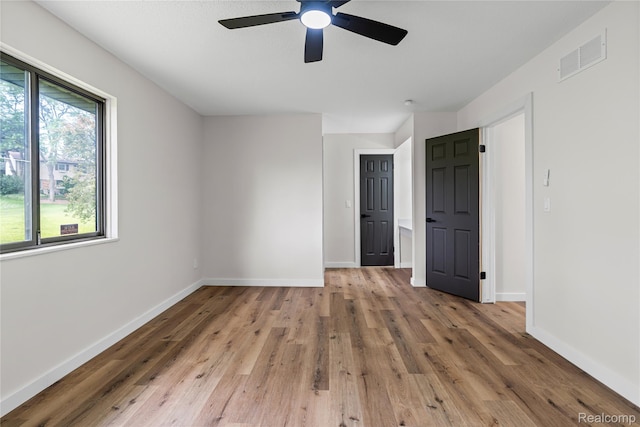 507 Charing Cross Dr, Grand Blanc, MI 48439 - unfurnished bedroom with light wood-style floors and ceiling fan