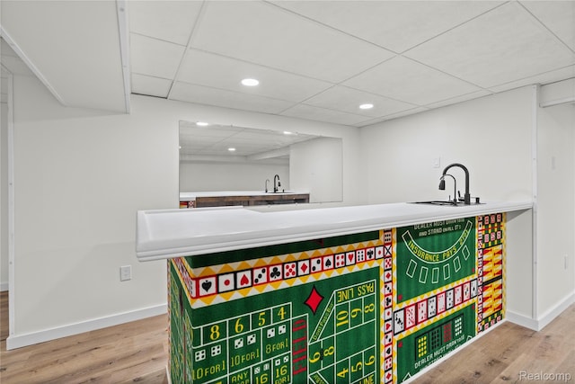 507 Charing Cross Dr, Grand Blanc, MI 48439 - detailed view of wood finished floors, bar with sink, recessed lighting, and a paneled ceiling