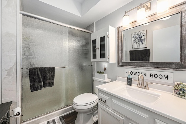 541 Maryland Ave NE Unit 39, Grand Rapids, MI 49503 - bathroom featuring vanity, a stall shower, and wood finished floors