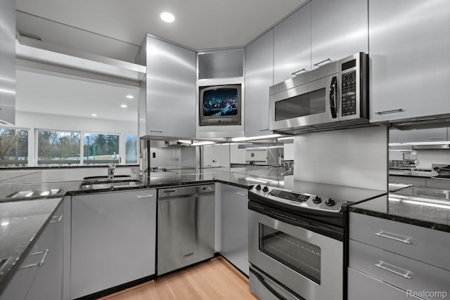 511 Brookside Ave, Birmingham, MI 48009 - kitchen with stainless steel appliances, gray cabinetry, dark stone counters, recessed lighting, and light wood-type flooring