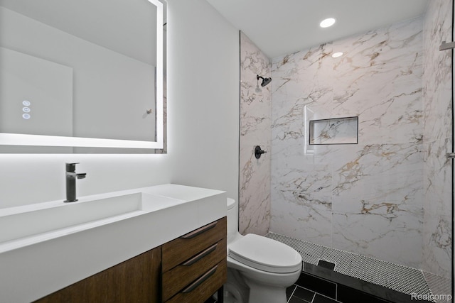 511 Brookside Ave, Birmingham, MI 48009 - bathroom featuring vanity, a marble finish shower, and recessed lighting