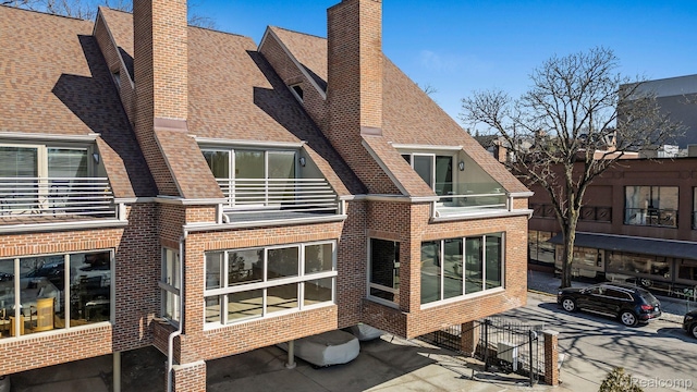 511 Brookside Ave, Birmingham, MI 48009 - back of property with brick siding, a chimney, and a shingled roof