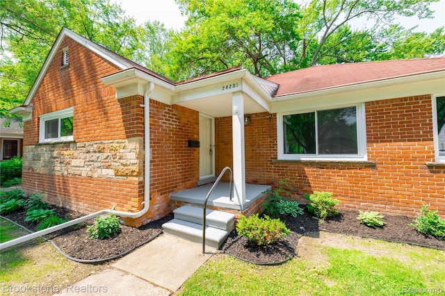 24251 Cloverlawn St, Oak Park, MI 48237 - view of front of home with brick siding and stone siding
