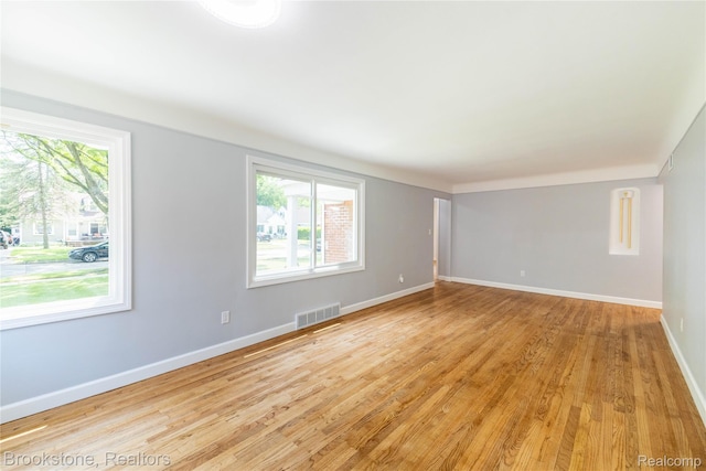 24251 Cloverlawn St, Oak Park, MI 48237 - empty room with plenty of natural light and light wood-style floors