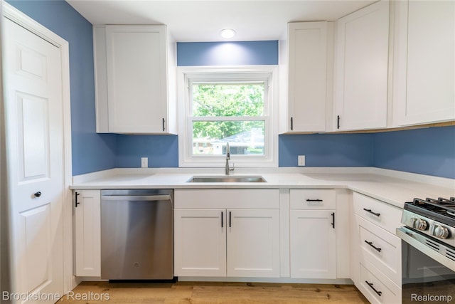 24251 Cloverlawn St, Oak Park, MI 48237 - kitchen with appliances with stainless steel finishes, white cabinetry, and light countertops