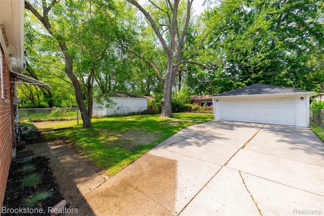 24251 Cloverlawn St, Oak Park, MI 48237 - view of yard with an outdoor structure and a detached garage