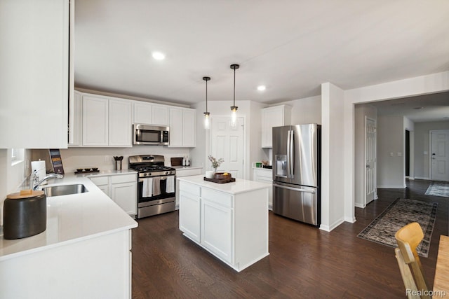 4278 Oak St, Grand Blanc, MI 48439 - kitchen featuring appliances with stainless steel finishes, dark wood-style floors, white cabinets, light countertops, and recessed lighting