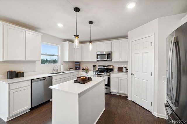4278 Oak St, Grand Blanc, MI 48439 - kitchen featuring appliances with stainless steel finishes, dark wood finished floors, white cabinetry, light countertops, and recessed lighting