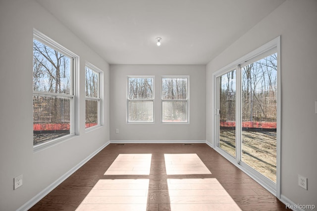 4278 Oak St, Grand Blanc, MI 48439 - unfurnished sunroom with baseboards and wood finished floors