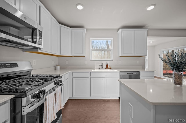4278 Oak St, Grand Blanc, MI 48439 - kitchen with stainless steel appliances, light countertops, recessed lighting, and white cabinetry