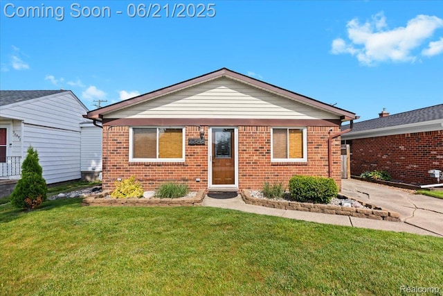 30546 Townley St, Madison Heights, MI 48071 - view of front of house with brick siding, a front lawn, and concrete driveway